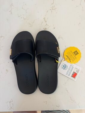 Cobian Black Slide Sandals with Gold Accent